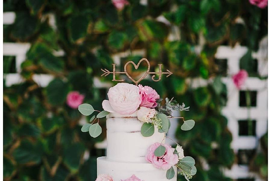 White cake with flowers and leaves