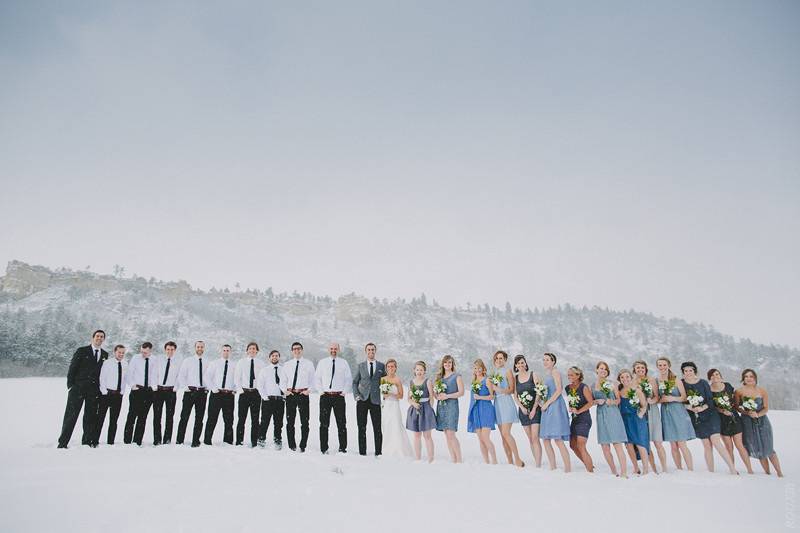 The couple with the bridesmaids and groomsmen