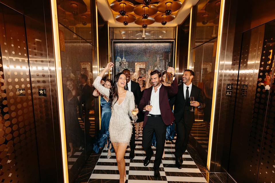 Wedding party by the elevator