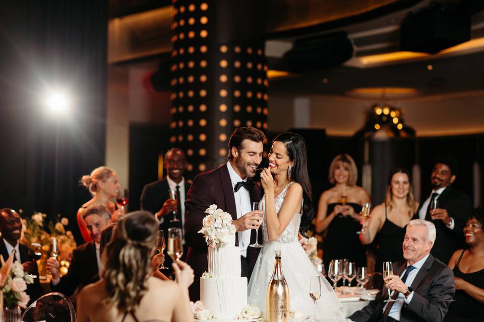 Bride and groom cutting cake