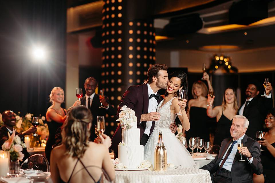 Bride and groom cutting cake