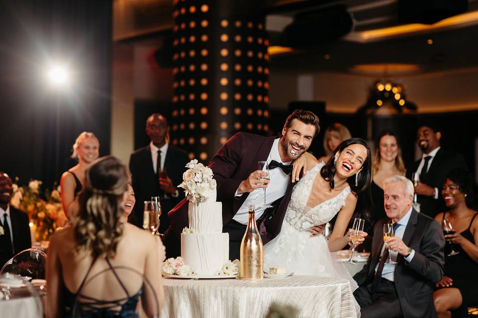 Bride and groom cutting cake