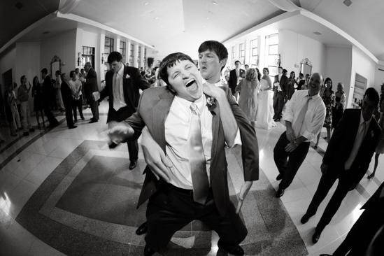 Groom having fun at reception.