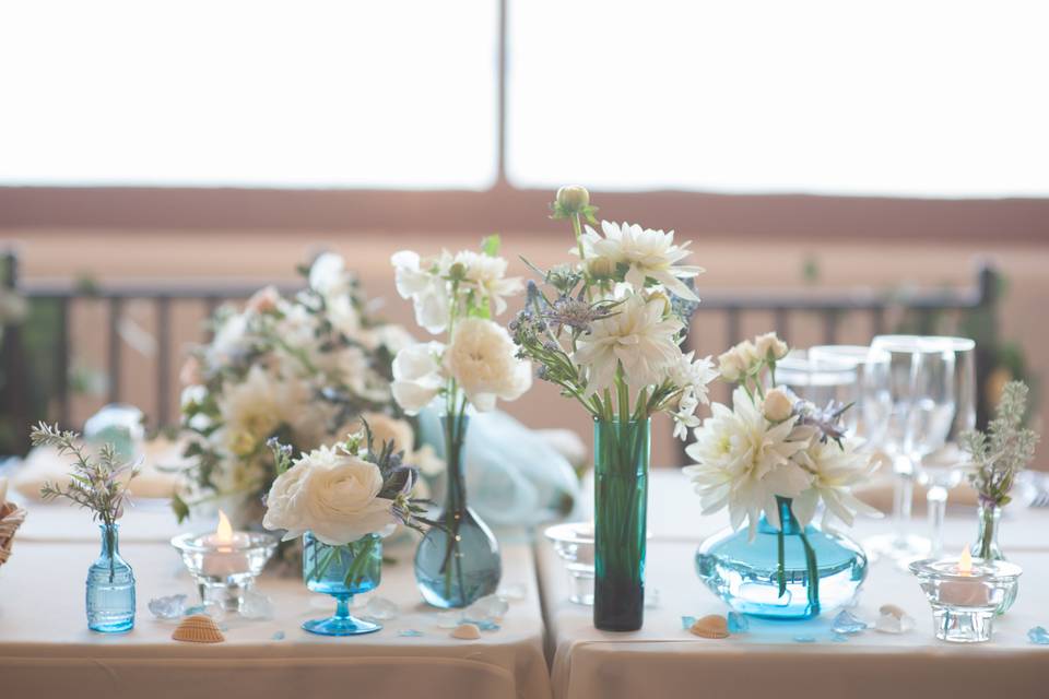 A collection of vintage vases for the head table.
