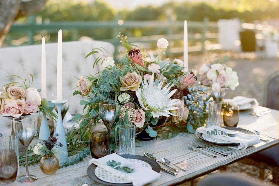 Smokey hues and King Protea for the head table scape. Photo by Diana Marie