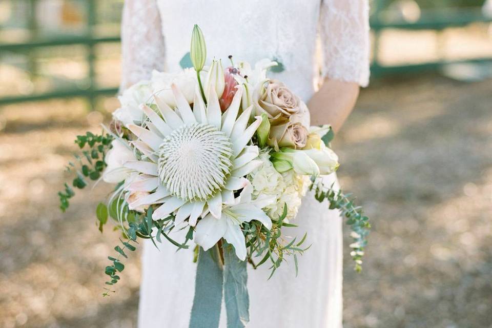 A romantic eclectic bouquet with white king protea.