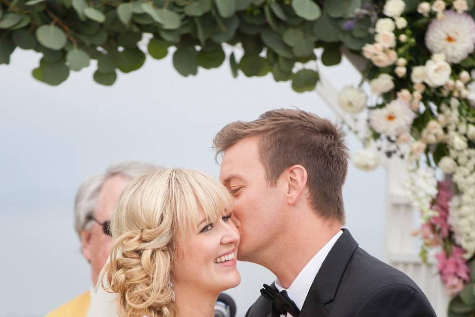 You may kiss the bride below an arbor overlooking the ocean!