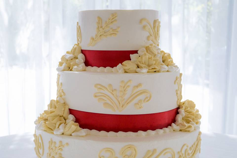 Wedding cake with red ribbons