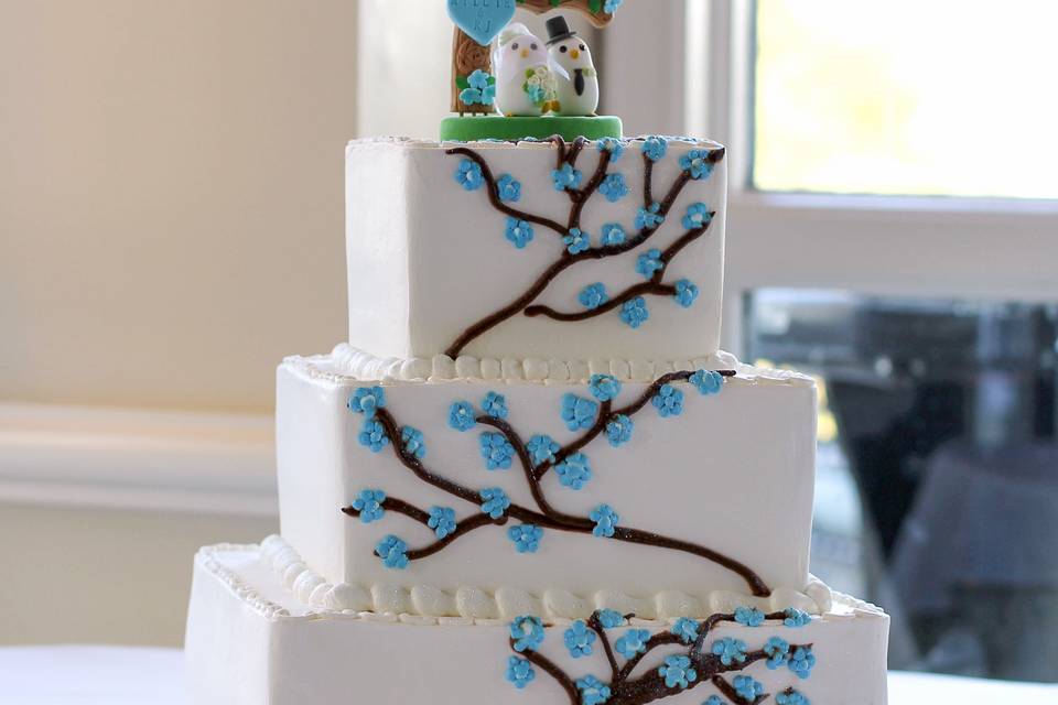 Wedding cake with blue flower piping