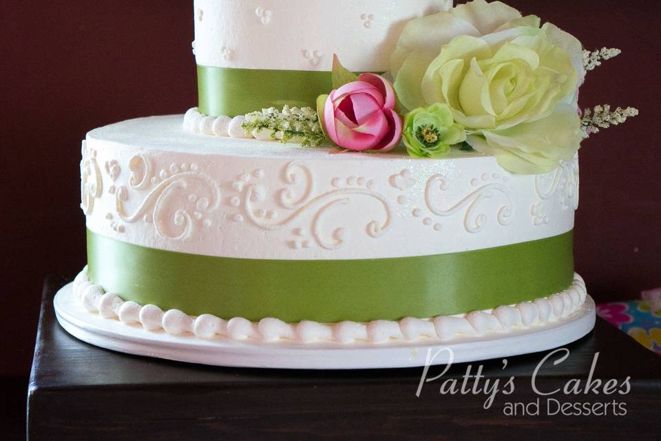 Wedding cake with green ribbons