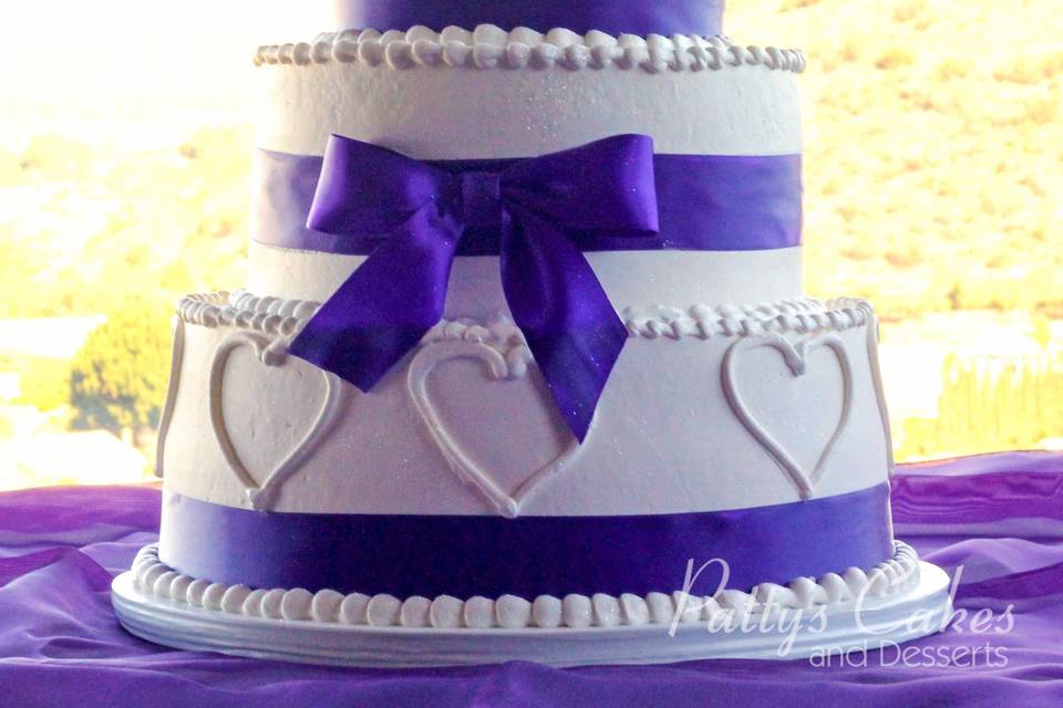 Wedding cake with purple bow