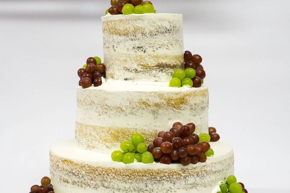 Naked wedding cake with grapes