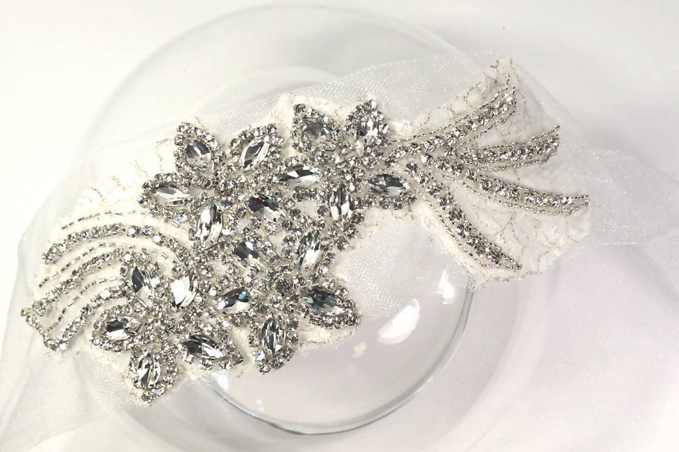 MONTE CARLO GODDESS | Handcrafted tulle and embroidered rhinestone hair accessory.
*Limited Edition. Available on ivory tulle to be worn in the front of on the side. Wear this gorgeous accessory on its own or with a veil, for your ceremony or switch into it for a stunning reception look.