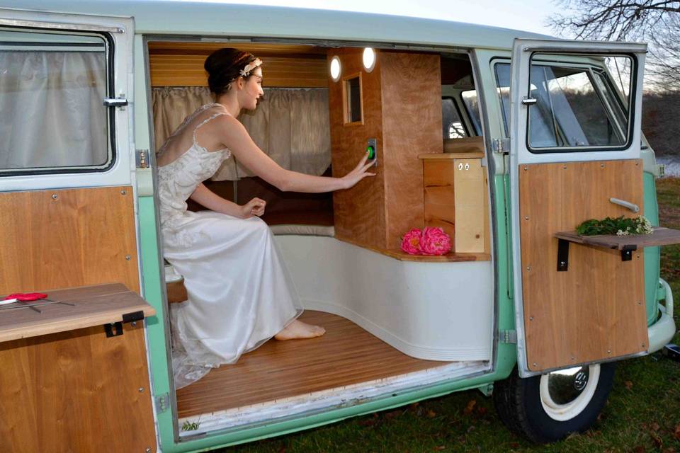 A bride taking selfies inside Chloe the VW photo bus