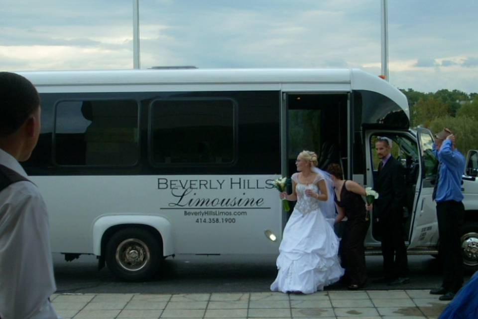 Bride getting off the bus