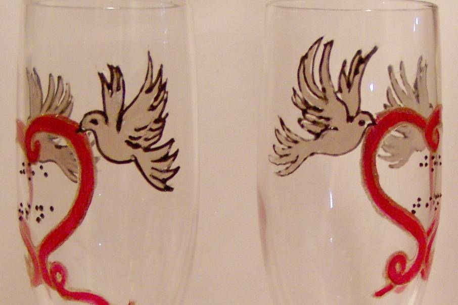 Customer design request of doves with red ribbon making a heart. Name of the bride and groom is in raised dot Braille. Design is outlined so they could feel the birds and the heart shape. 45th year Anniversary!