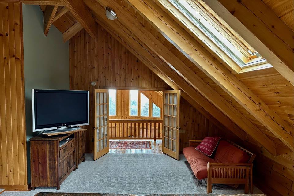 Primary suite in log chalet