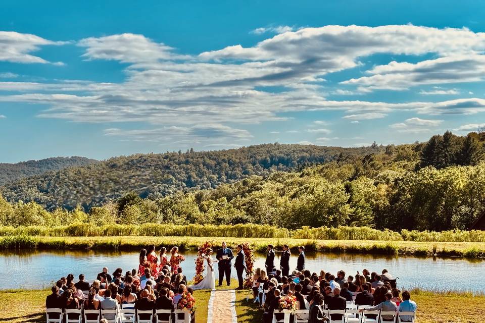 Outdoor waterfront wedding cer