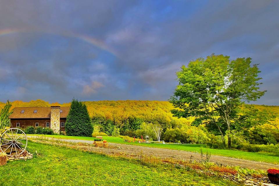 Log chalet home with rainbow
