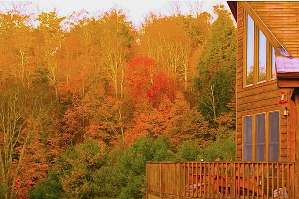 Chalet log home deck in fall