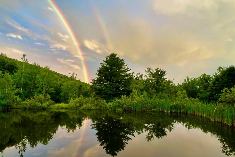 Large pond and rainbow