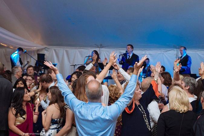 Wedding party dancing to rare form