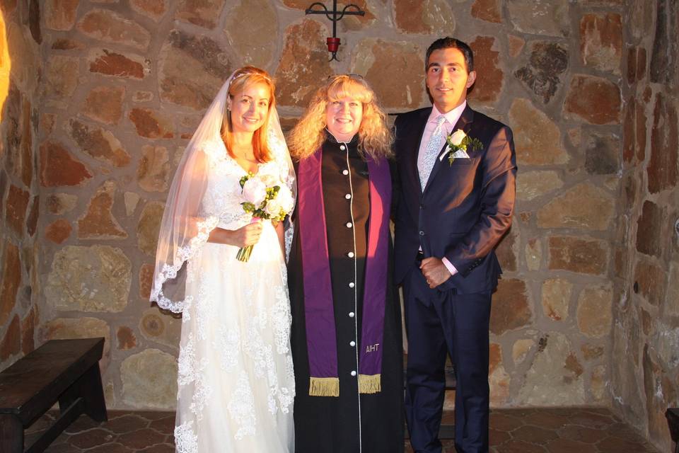 The newlyweds with the officiant