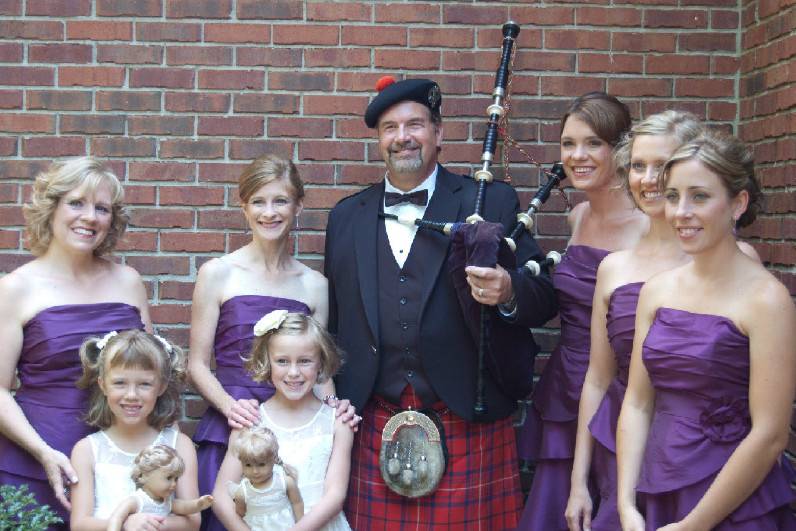 I actually played on the front porch of the brides home before the wedding. The bridesmaid come out for a photo.