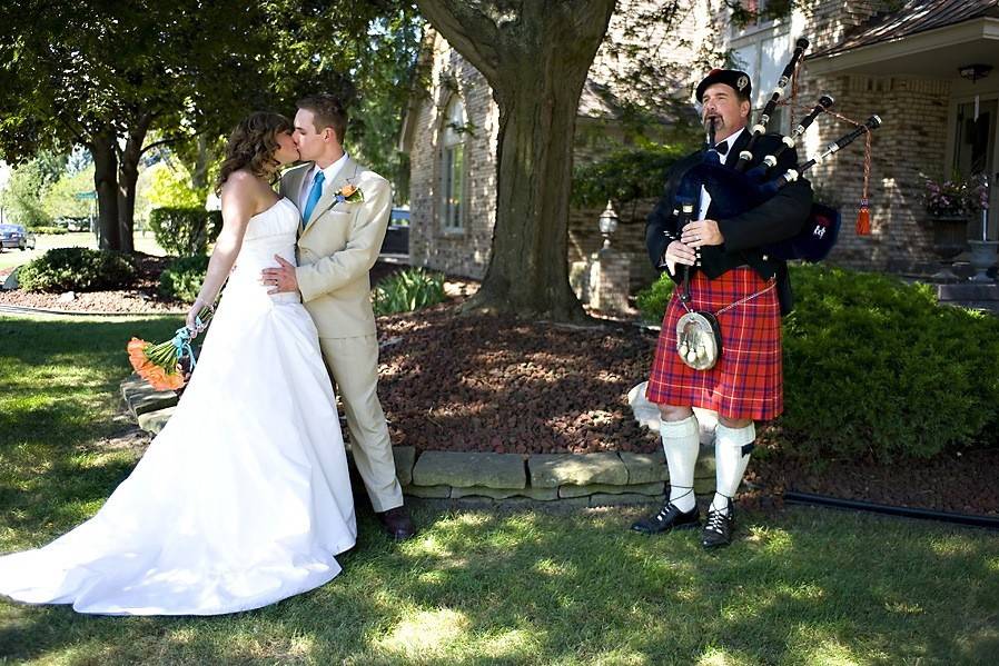 Beautiful backyard garden wedding. Complete with Clinton River running through it. The perfect pose.