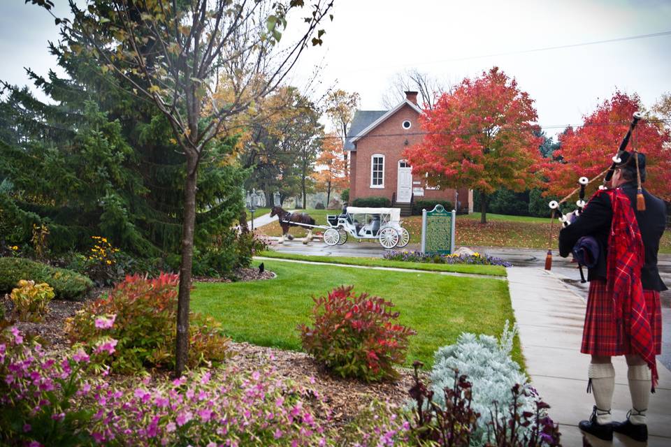 Piping the newlyweds off after the ceremony for their Frankenmuth carriage ride.