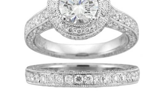 This elegant matching engagement ring and band are set with round diamonds.