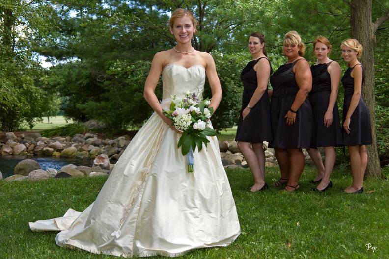 Bride and bridesmaids during outdoor wedding at Concordia College in Ann Arbor