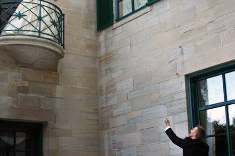 Just like Romeo and Juliet - Bride on balcony on mansion during outdoor wedding at Concordia College in Ann Arbor