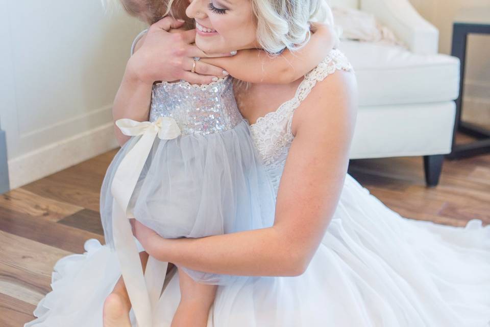 Bride hugging child