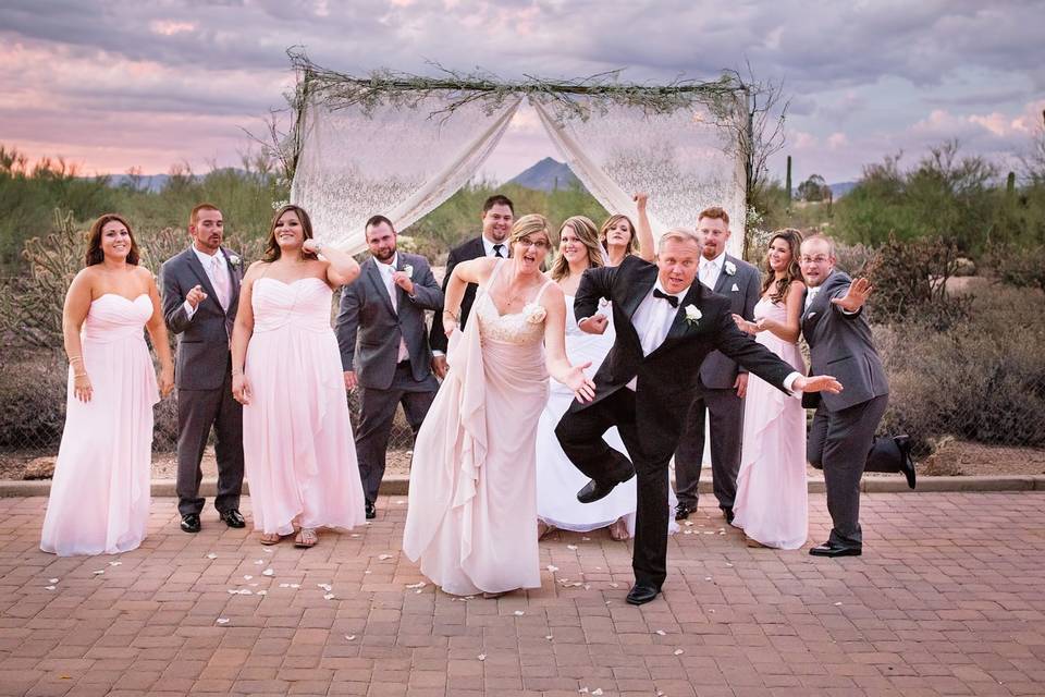 The couple with the bridesmaids and groomsmen