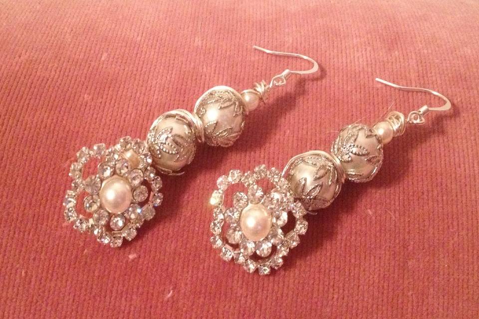 Earrings designed and created by Mystic Angel Creations. Materials used: artisan grade, nontarnishable wire, glass pearls and rhinestone buttons