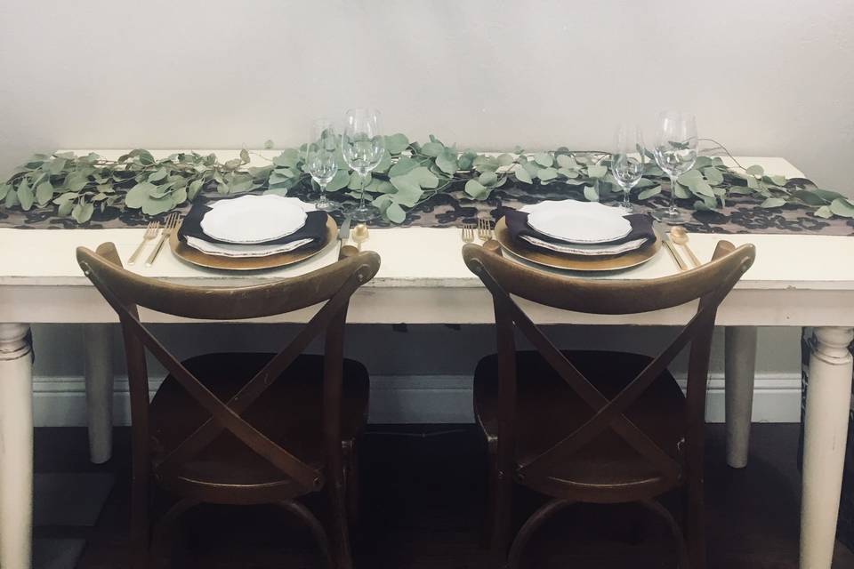 Vintage cream sweetheart table with french country cross back chairs and unique rustica stave chandelier