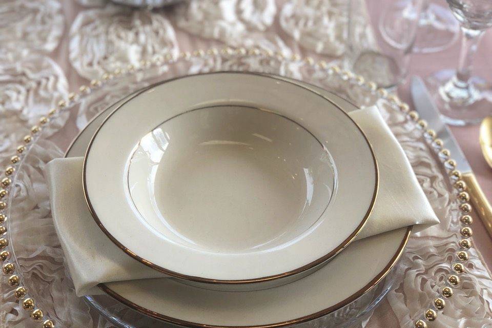 Gold border china collection with ivory shantung and antique ivory rosette linens