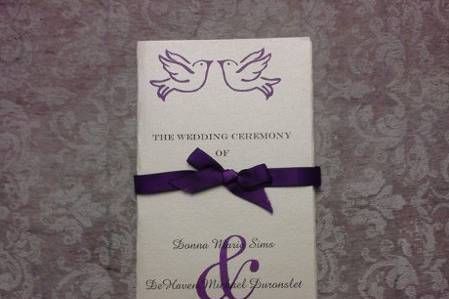 Trifolfd wedding program with ribbon