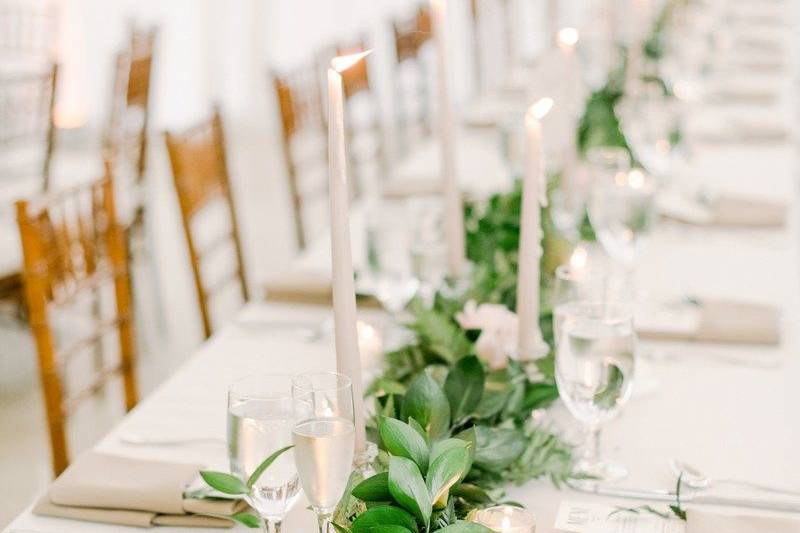 An elegant garland with votive candles