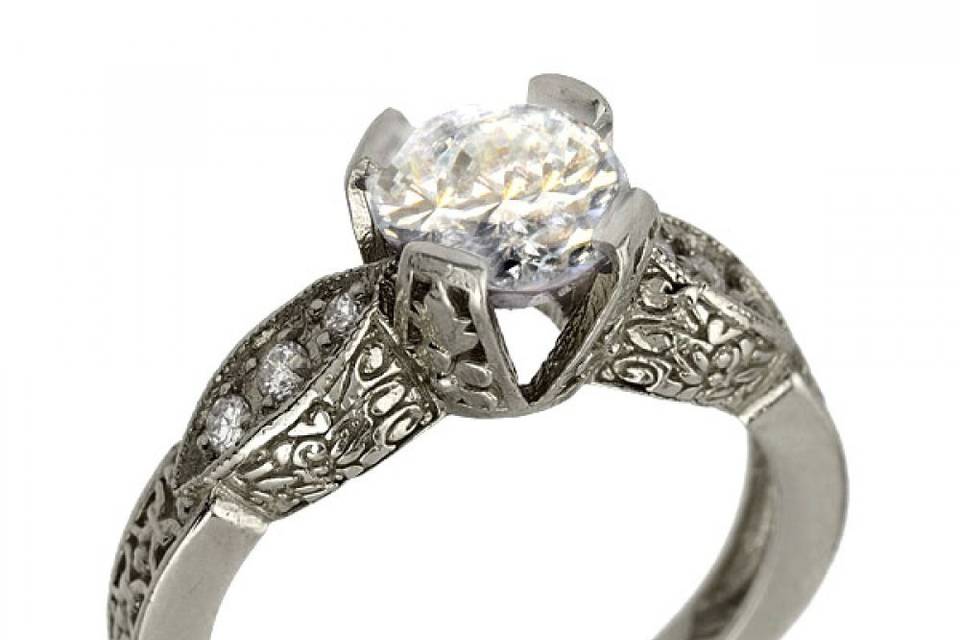 Vintage inspired diamond ring with filigree scrolling along the sides