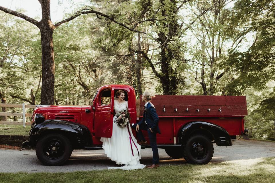 Red/black truck with couple