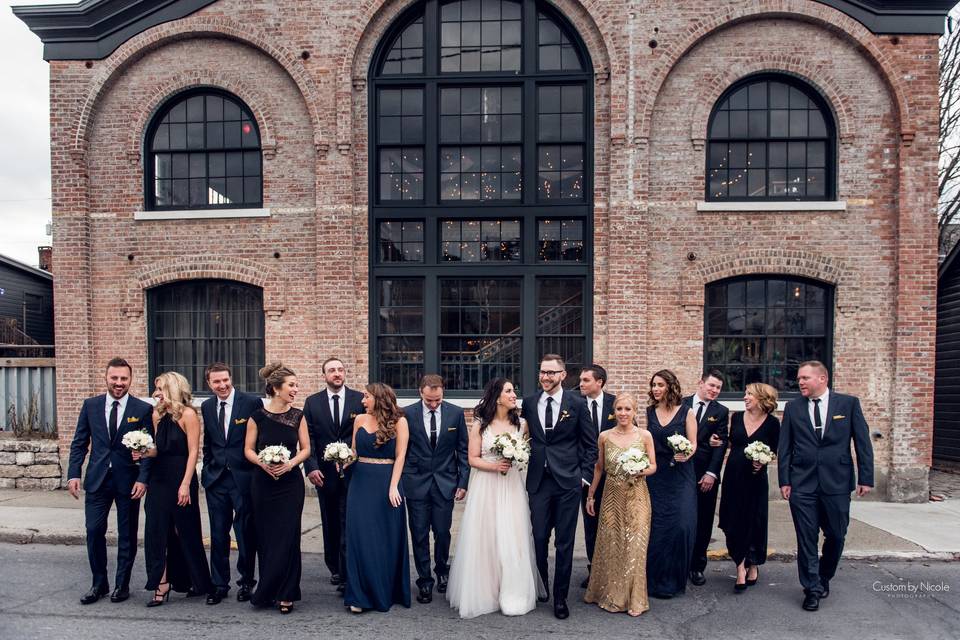 The couple with the bridesmaids and groomsmen