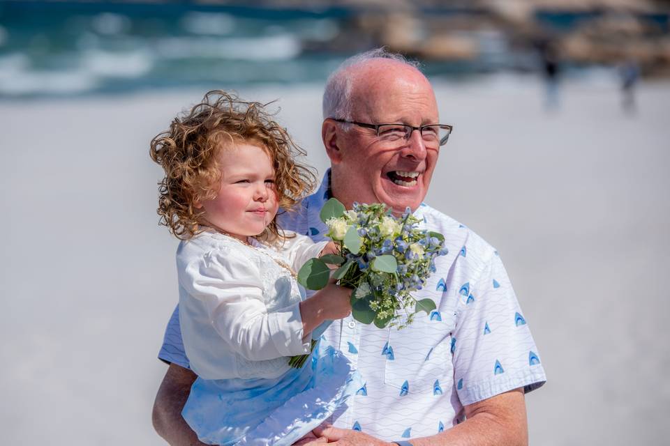 Smiling and child holding flowers