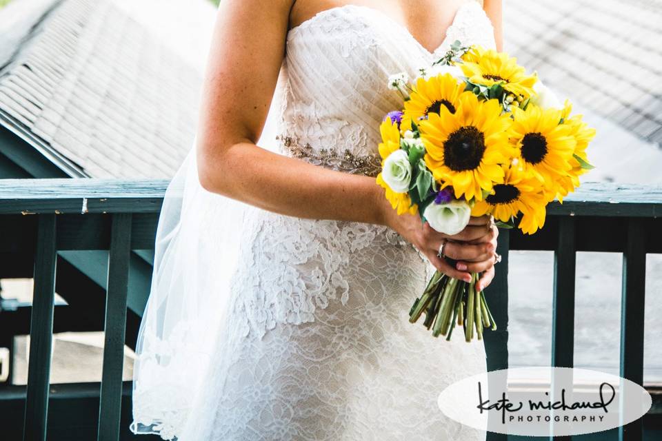 A wedding full of Sunflowers.  Photo credit goes to Kate Michaud Photography.