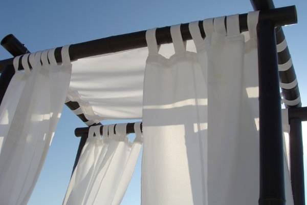 White drapes and canopy make this so romantic.