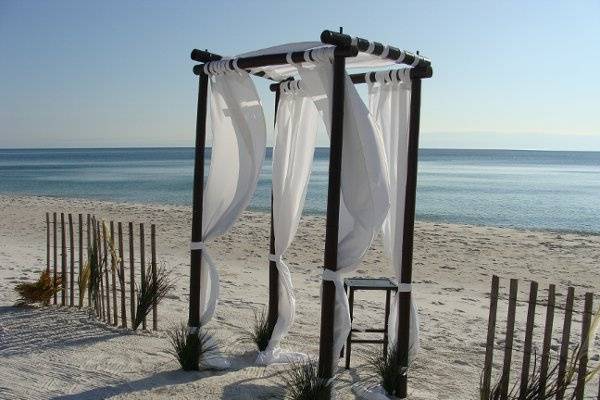 The wind fence and natural grasses make this romantic beach location perfect.