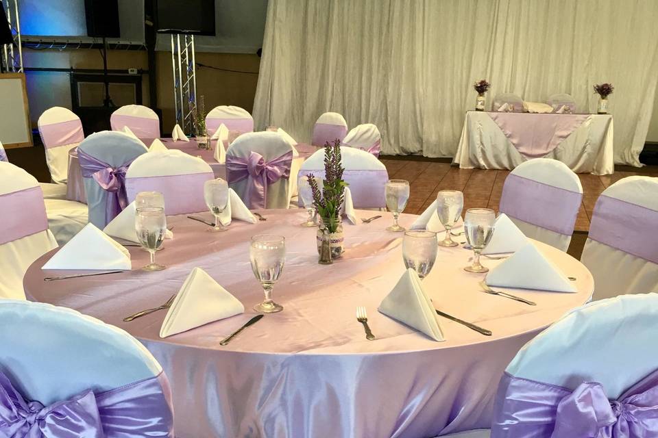 Lavender overlay with satin white tablecloths