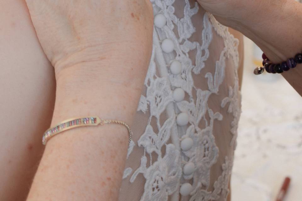 Bride dress being buttoned