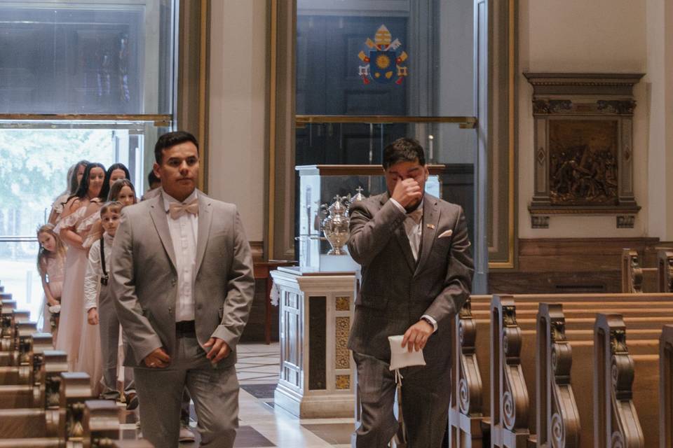 Emotional groom walking down
